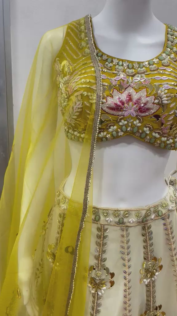Mustard floral lehenga choli set filmed from the front and side