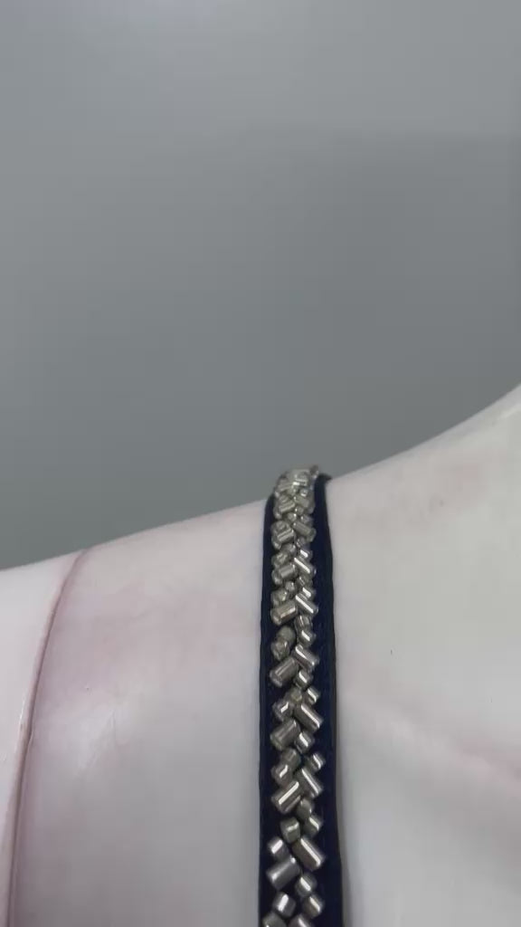 Noir silver embellished pre-draped saree shown in movement on model