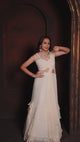 Ivory Ruffle Layered Georgette Lehenga Set with Embroidered Sheer Cape & Draped Corset Blouse – Minimalist Luxe Couture