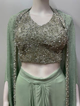 Mint green set with a fitted bustier and floor-length draped skirt