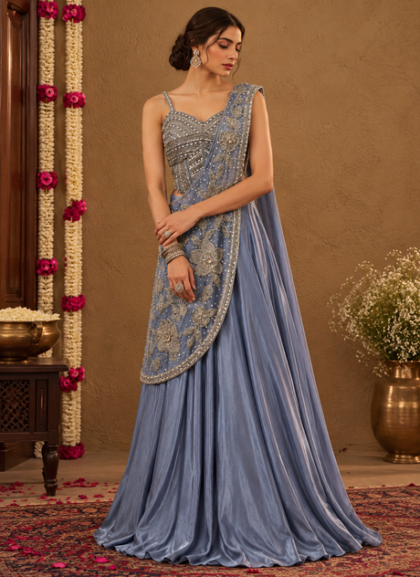 Steel blue lehenga set with a silver beaded blouse, floor-length skirt and floral statement drape